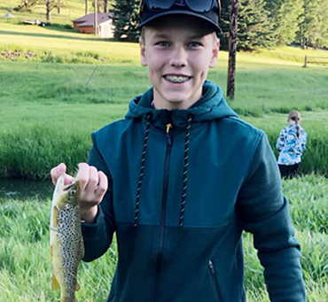 Boy fishing near Firehouse Campground in Hill City, SD